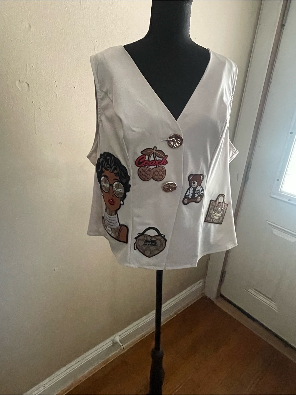 White Sleeveless Appliqué Vest with Playful Patches